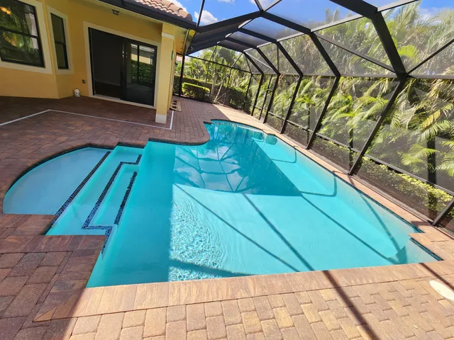 a view of a lobby with furniture and a floor to ceiling window