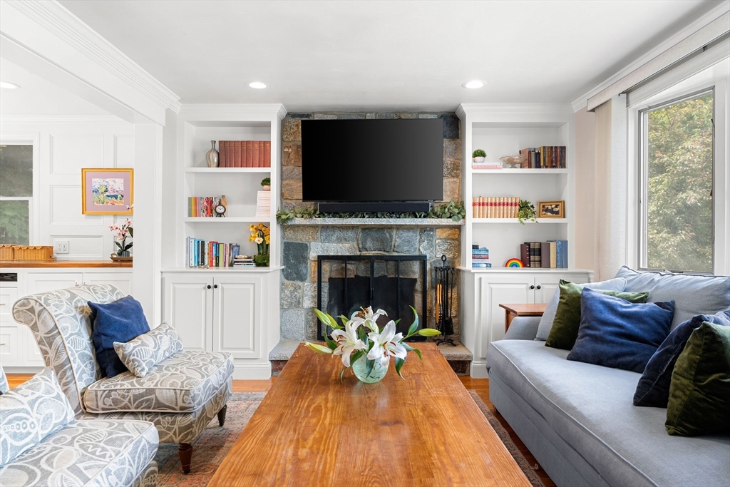 35 Spallus Road Stoughton, MA 02072 - Photo 6 of 39 a living room with furniture fireplace and a flat screen tv