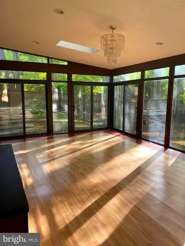 a view of an empty room with a balcony
