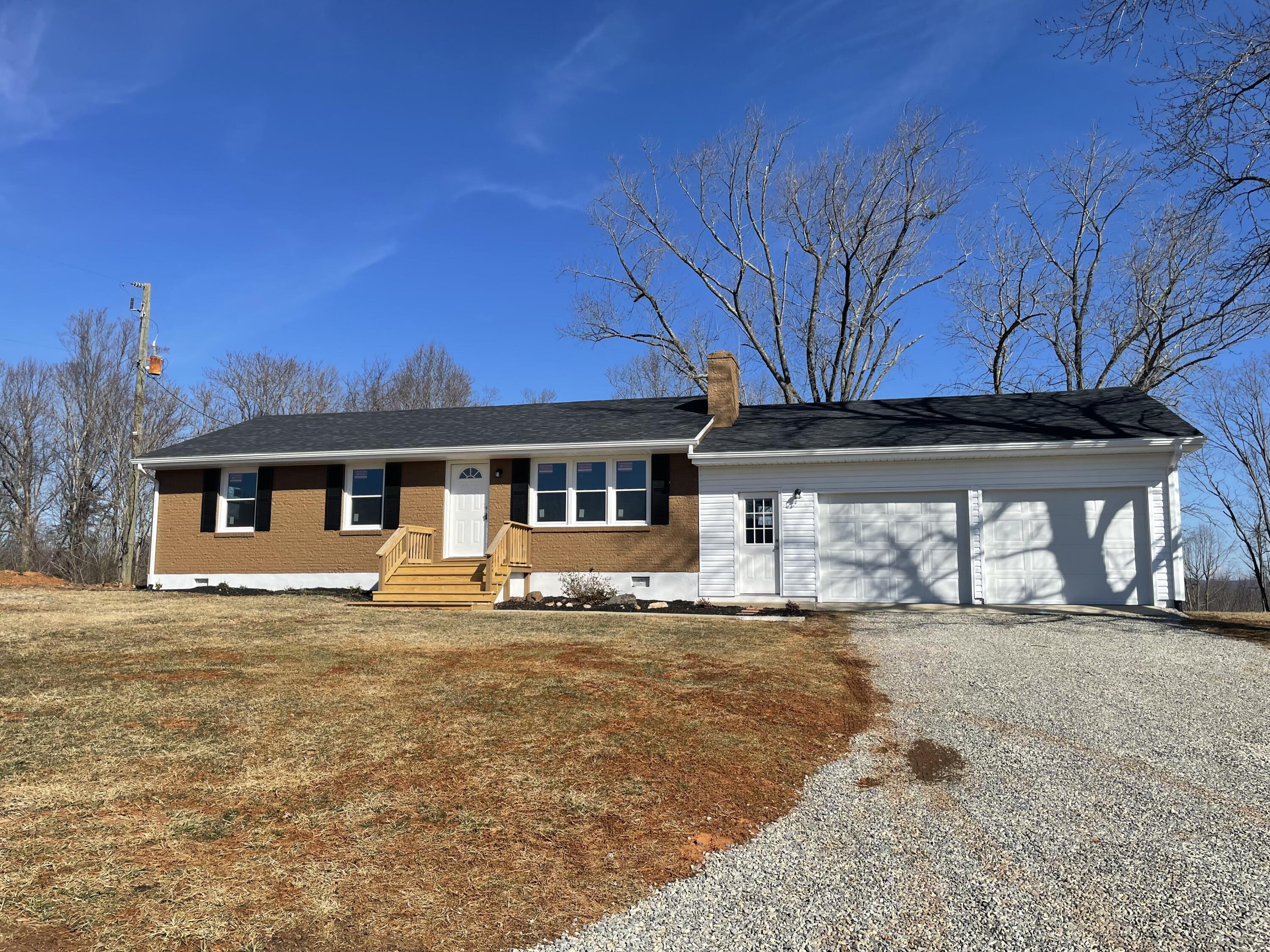 12514 Hardy Road Hardy, VA 24101 - Photo 1 of 12 a house that has a big yard and large trees