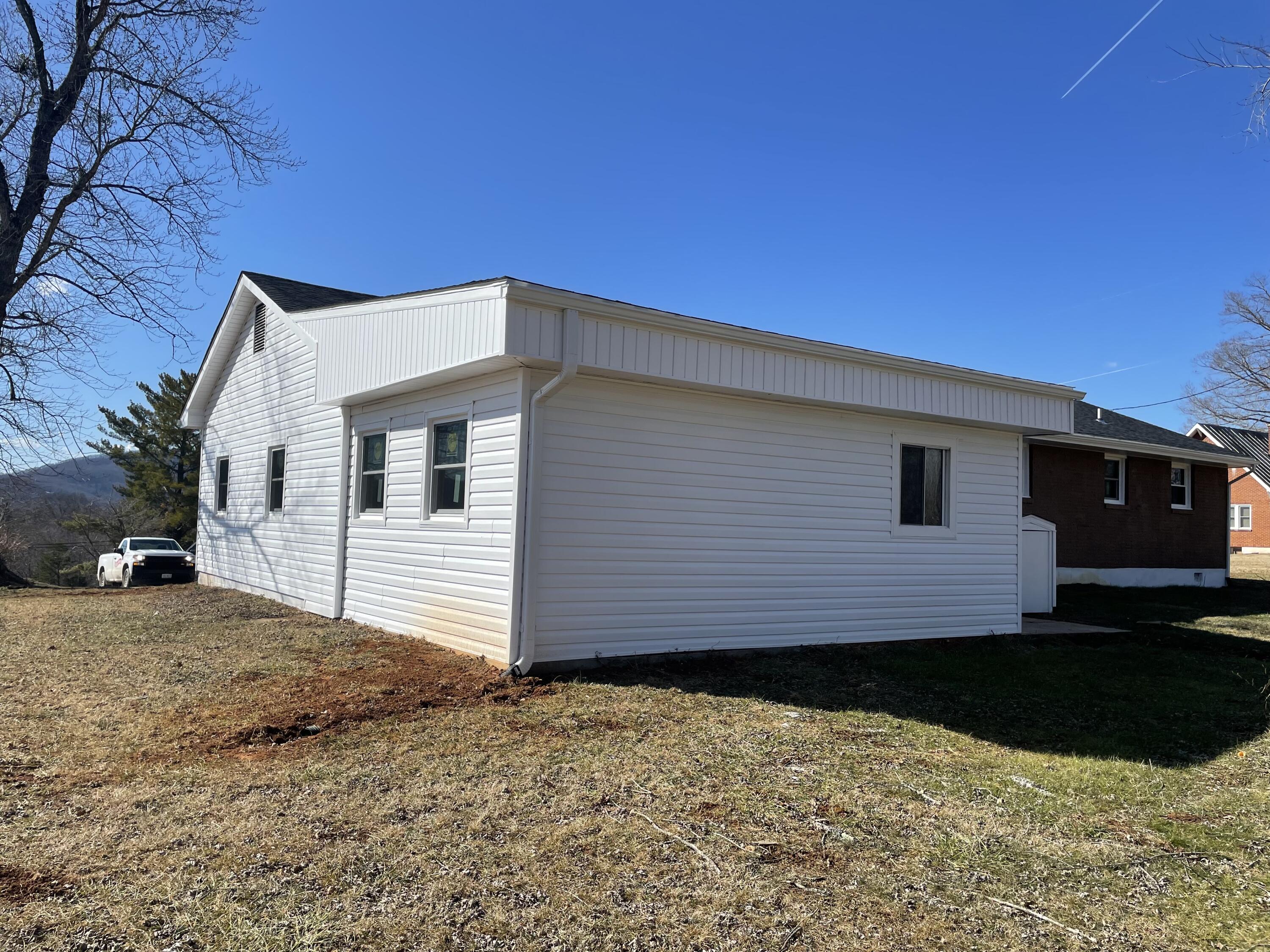 12514 Hardy Road Hardy, VA 24101 - Photo 3 of 12 a front view of a house with a yard