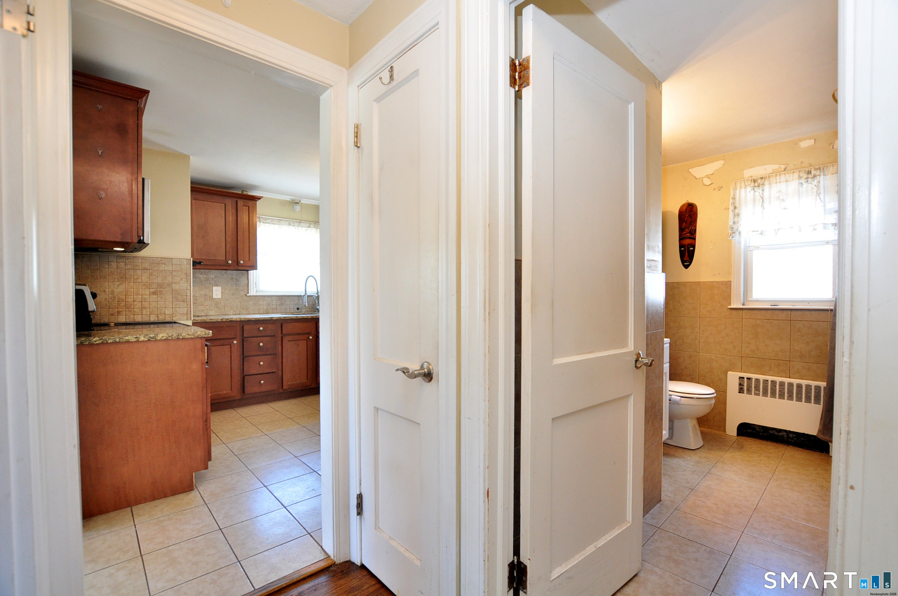 103 West Center Street Manchester, CT 06040 - Photo 18 of 29 a bathroom with a granite countertop sink and a mirror