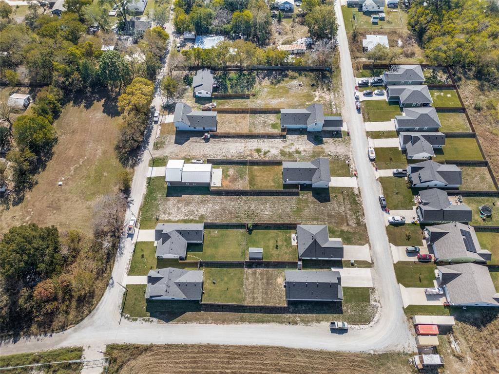310 North Helton Street Trenton, TX 75490 - Photo 2 of 4 a view of swimming pool with outdoor seating and plants