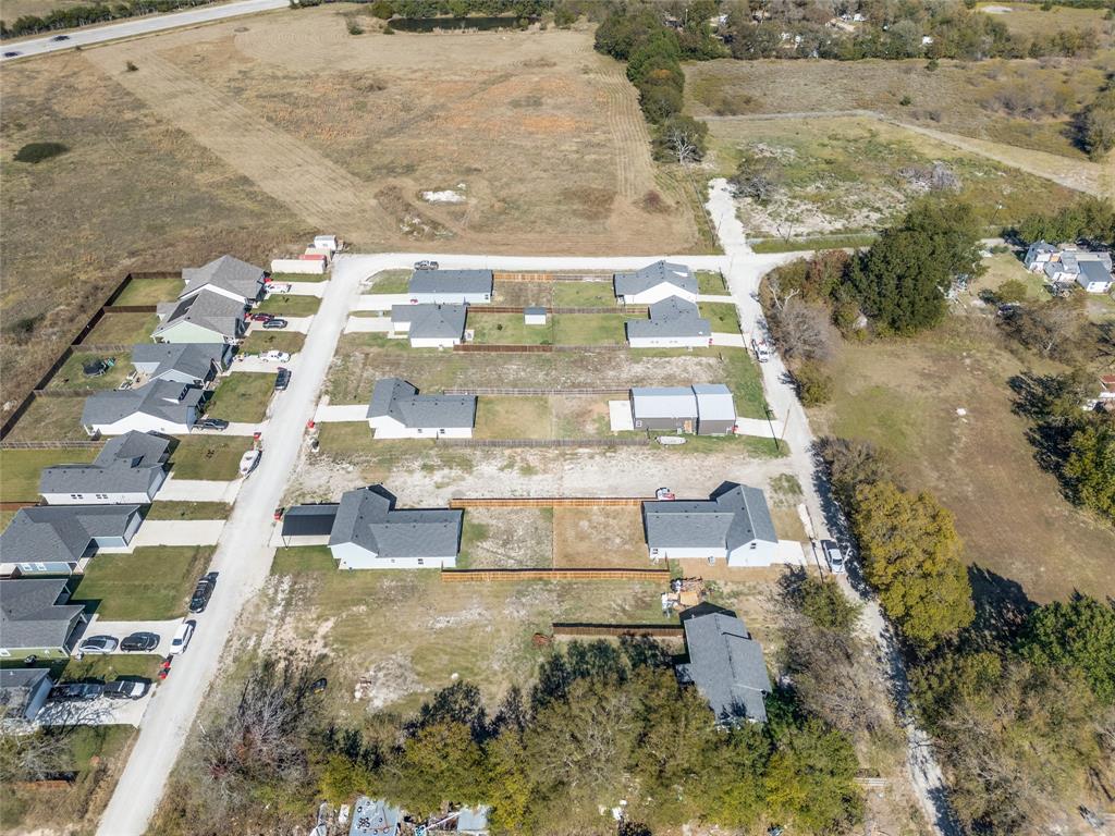 310 North Helton Street Trenton, TX 75490 - Photo 3 of 4 a view of residential houses with outdoor space