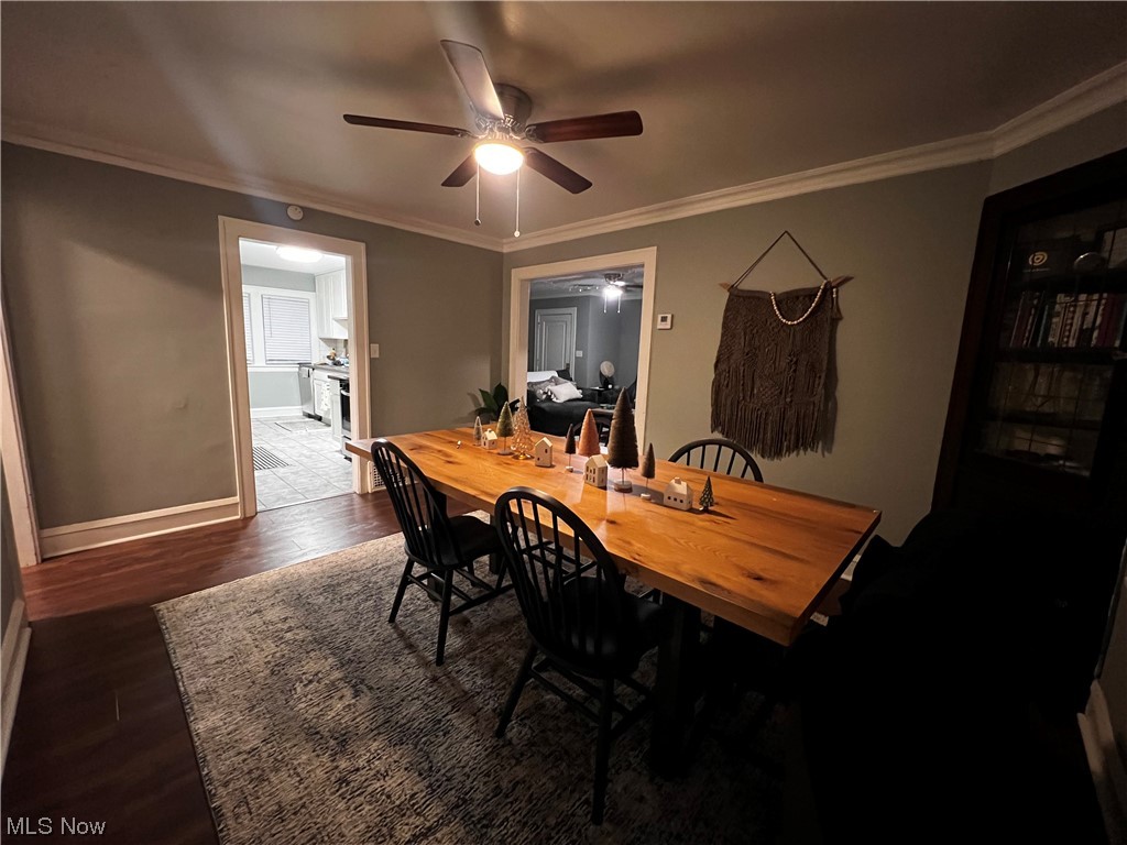 17108 Kenyon Road Cleveland, OH 44120 - Photo 8 of 35 Dining area with ornamental molding, dark hardwood / wood-style floors, and ceiling fan
