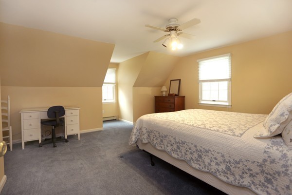 5 Silverbrook Road Boxford, MA 01921 - Photo 25 of 29 a bedroom with a bed and a chandelier
