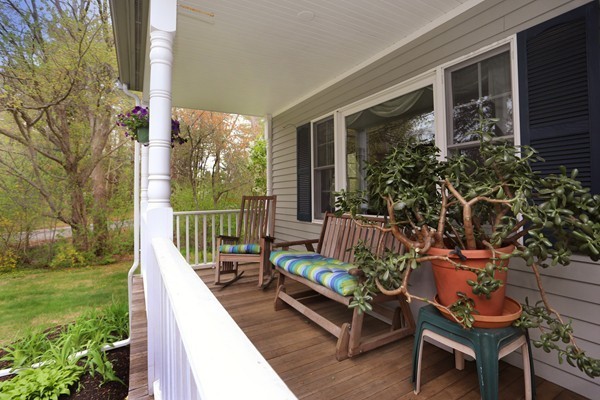 5 Silverbrook Road Boxford, MA 01921 - Photo 4 of 29 a balcony with wooden floor table and chairs