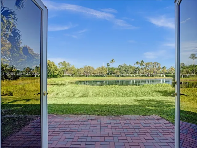 a view of empty room with wooden floor and cabinet