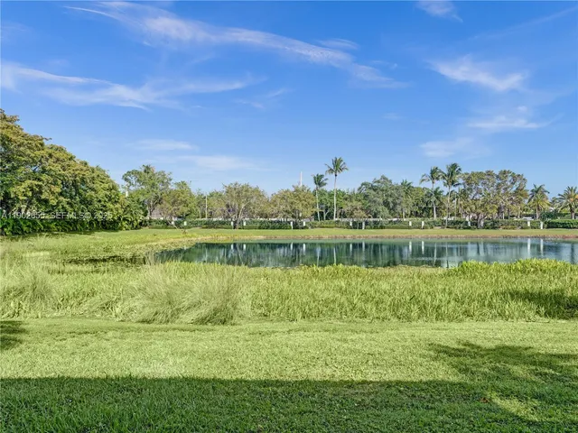 a kitchen with white cabinets and a sink