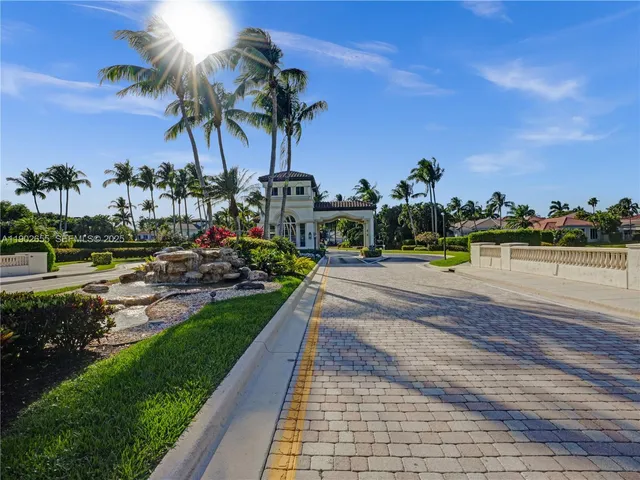 an aerial view of a house with a yard and potted plants