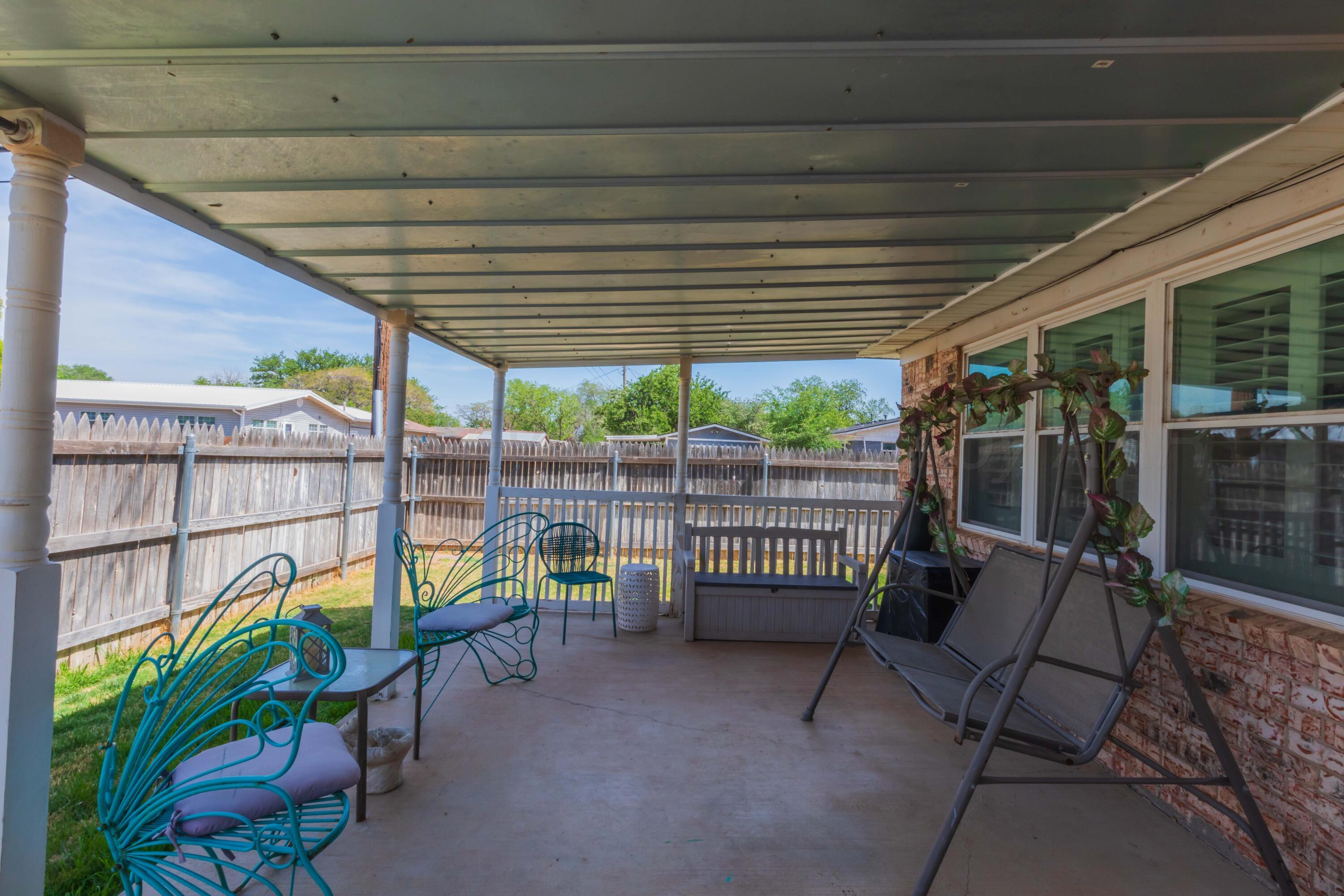 4800 South Austin Street Amarillo, TX 79110 - Photo 25 of 29 a view of a chairs and table in patio