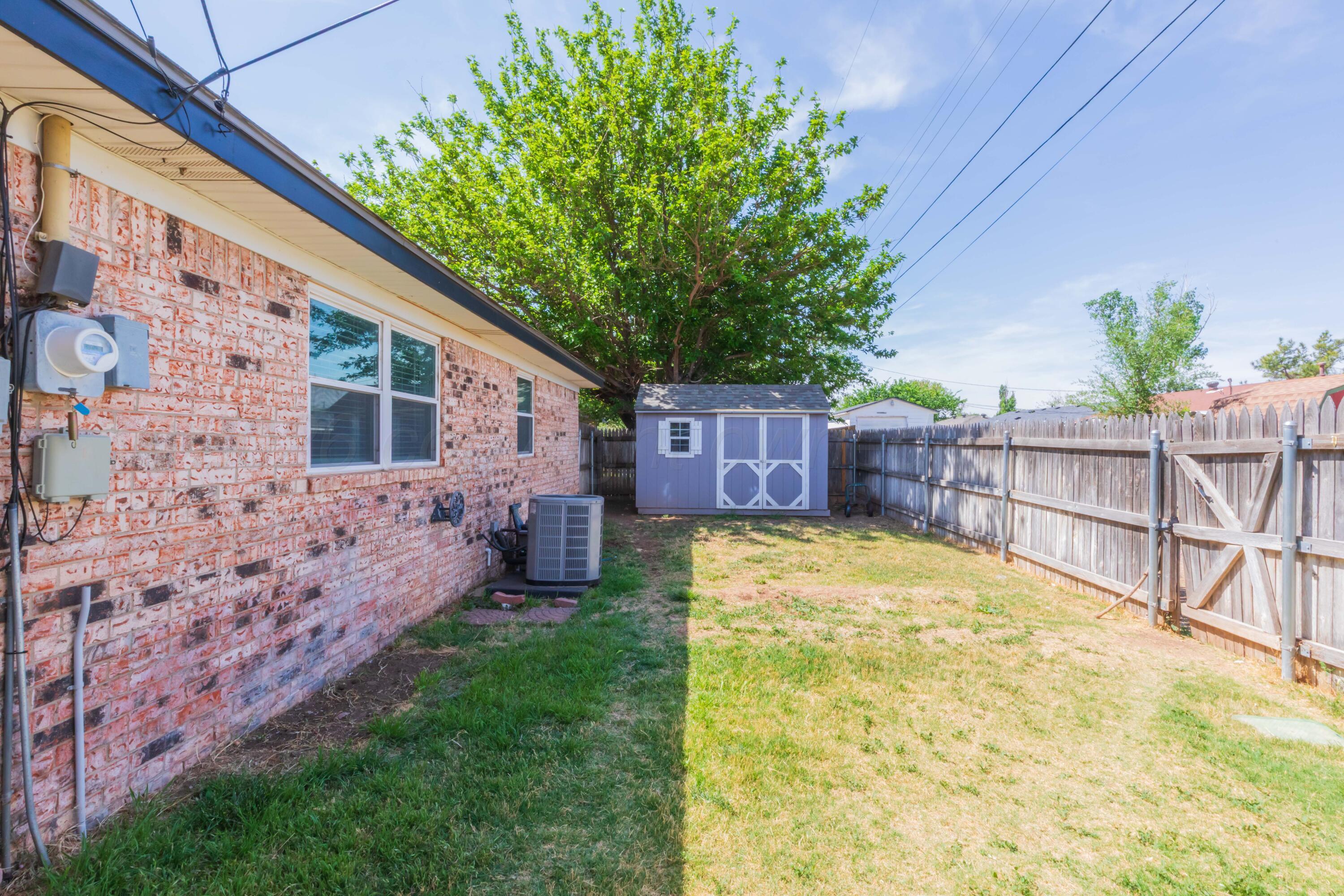 4800 South Austin Street Amarillo, TX 79110 - Photo 28 of 29 a view of house with backyard and seating space