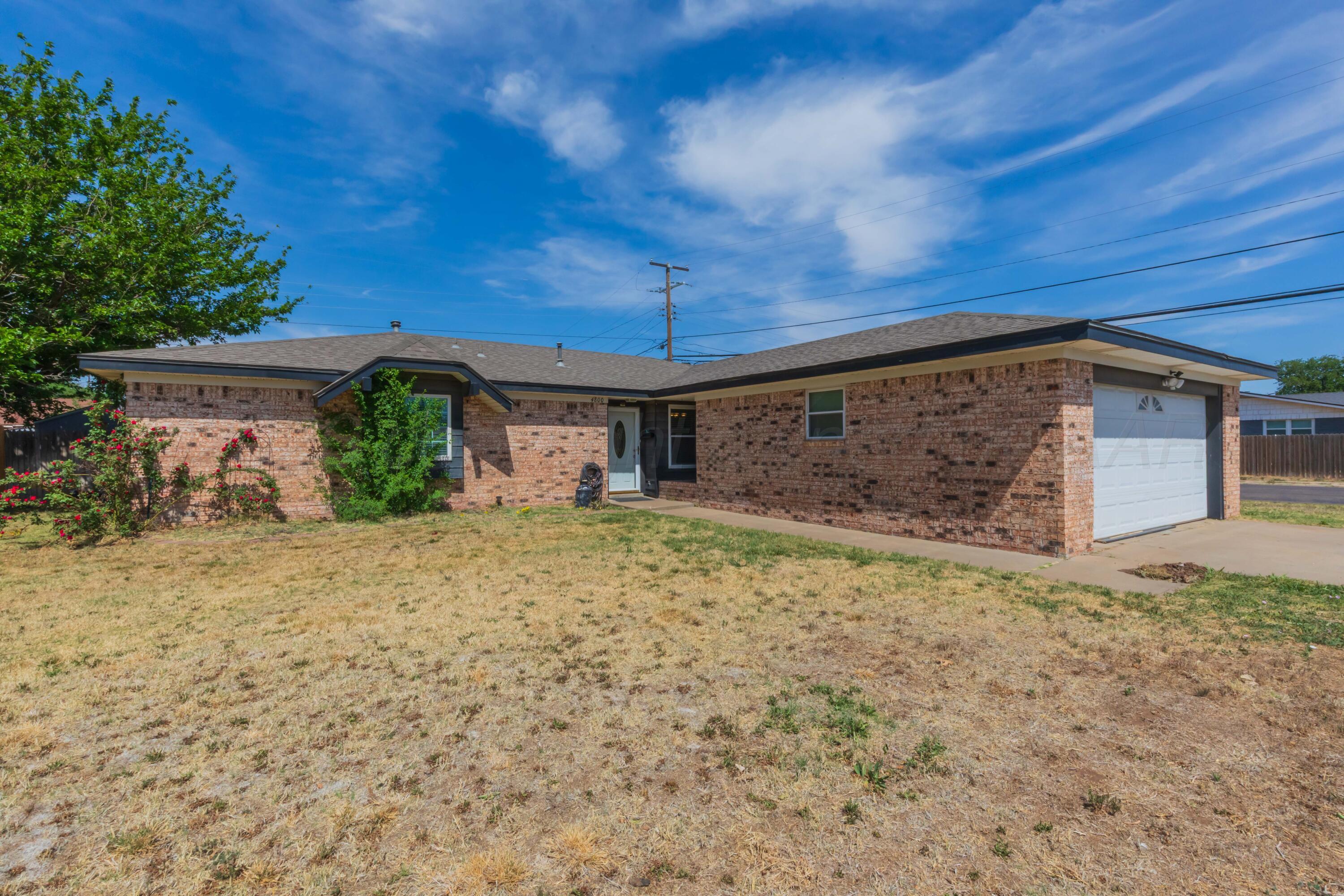 4800 South Austin Street Amarillo, TX 79110 - Photo 3 of 29 a front view of a house with a yard