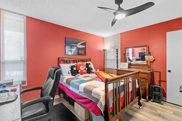 a bedroom with furniture and a chandelier