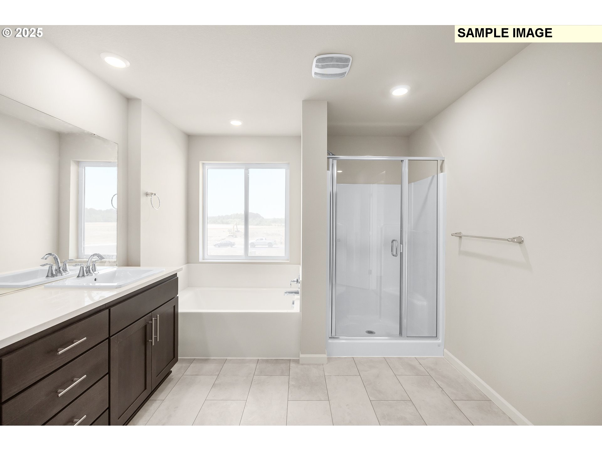 1472 Southeast Logan Parkway Albany, OR 97322 - Photo 15 of 23 a bathroom with a double vanity sink a large mirror and a bathtub