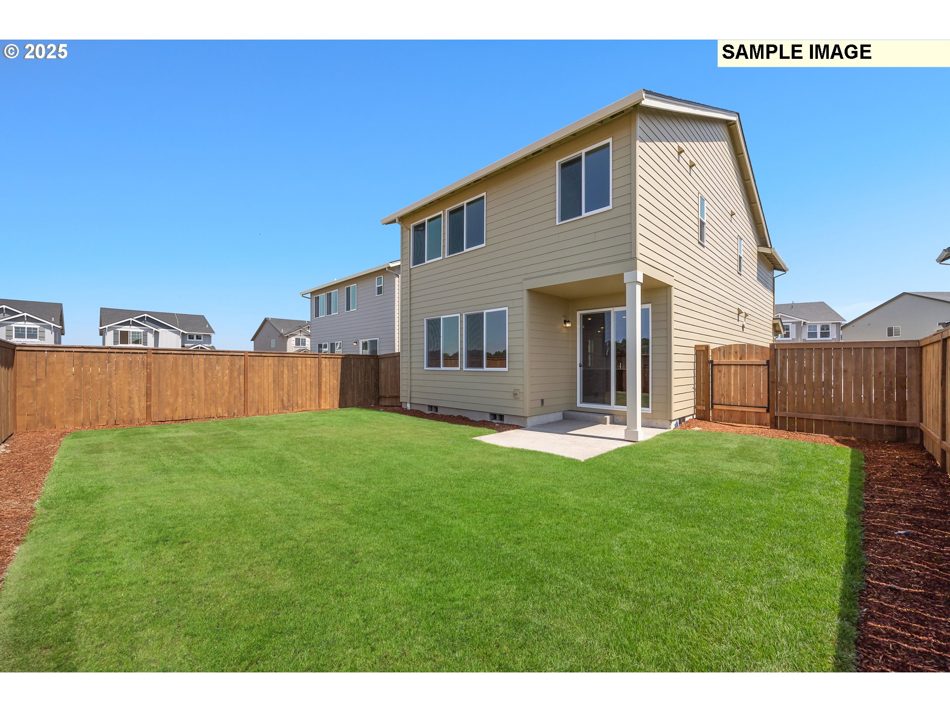 1472 Southeast Logan Parkway Albany, OR 97322 - Photo 21 of 23 a front view of a house with backyard and wooden fence