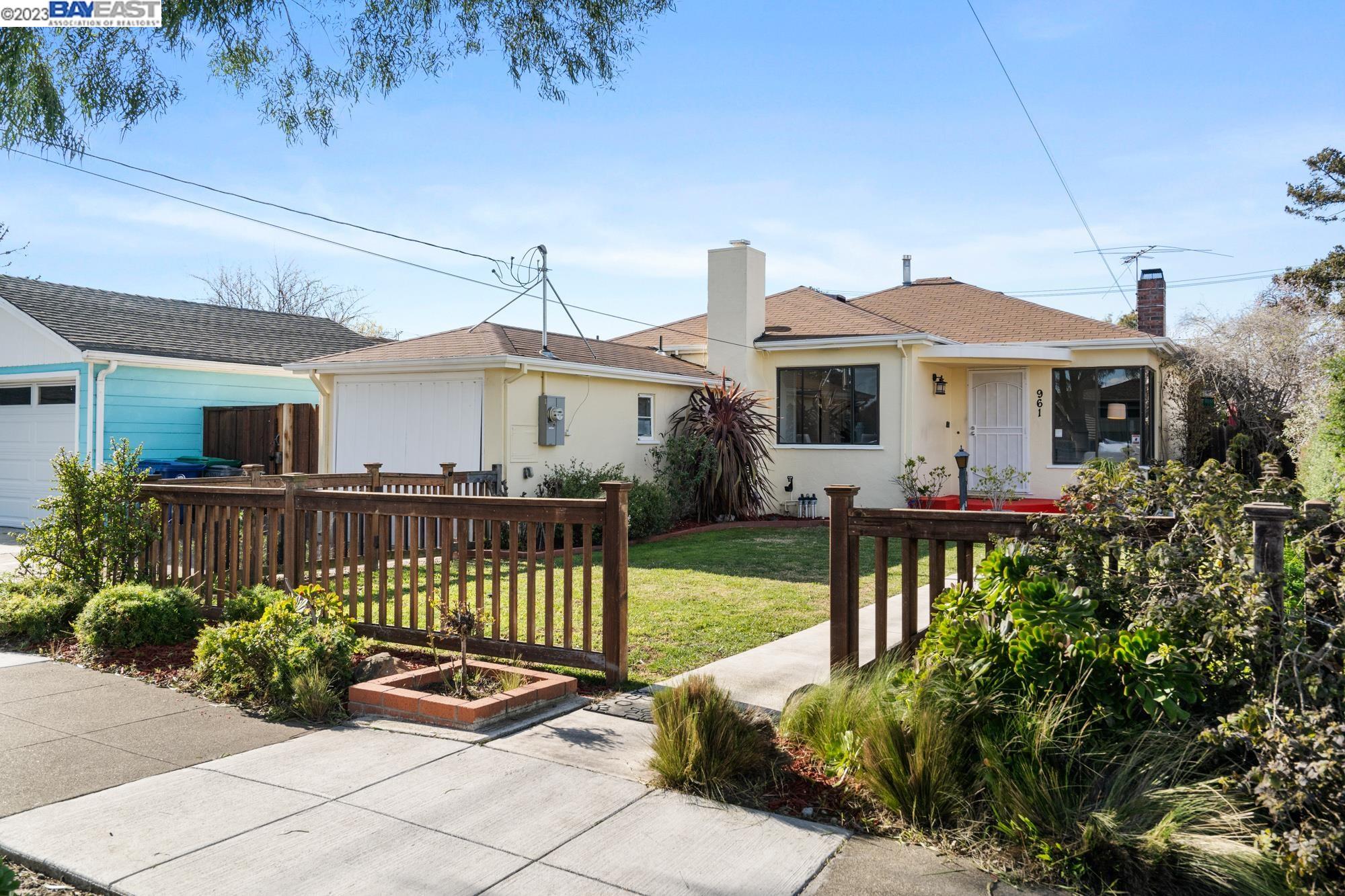 a view of a house with garden and plants