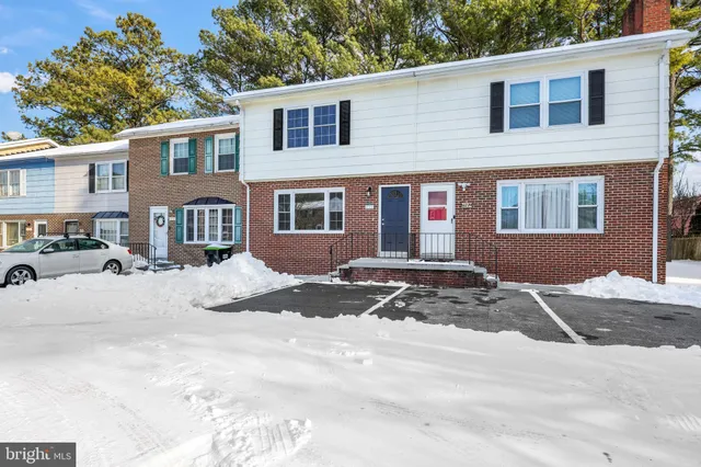 a view of a house with a snow on the road