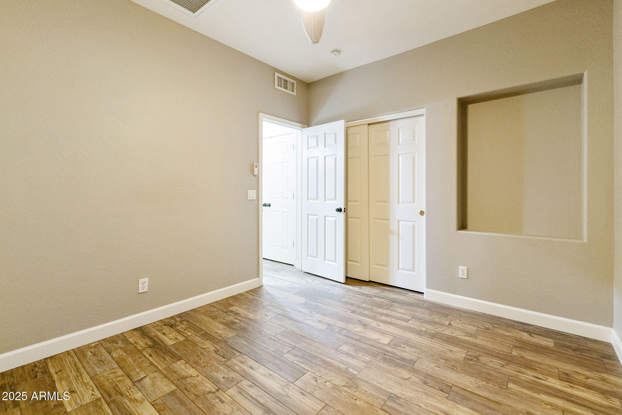 2129 South Compton Mesa, AZ 85209 - Photo 14 of 28 a view of an empty room with wooden floor