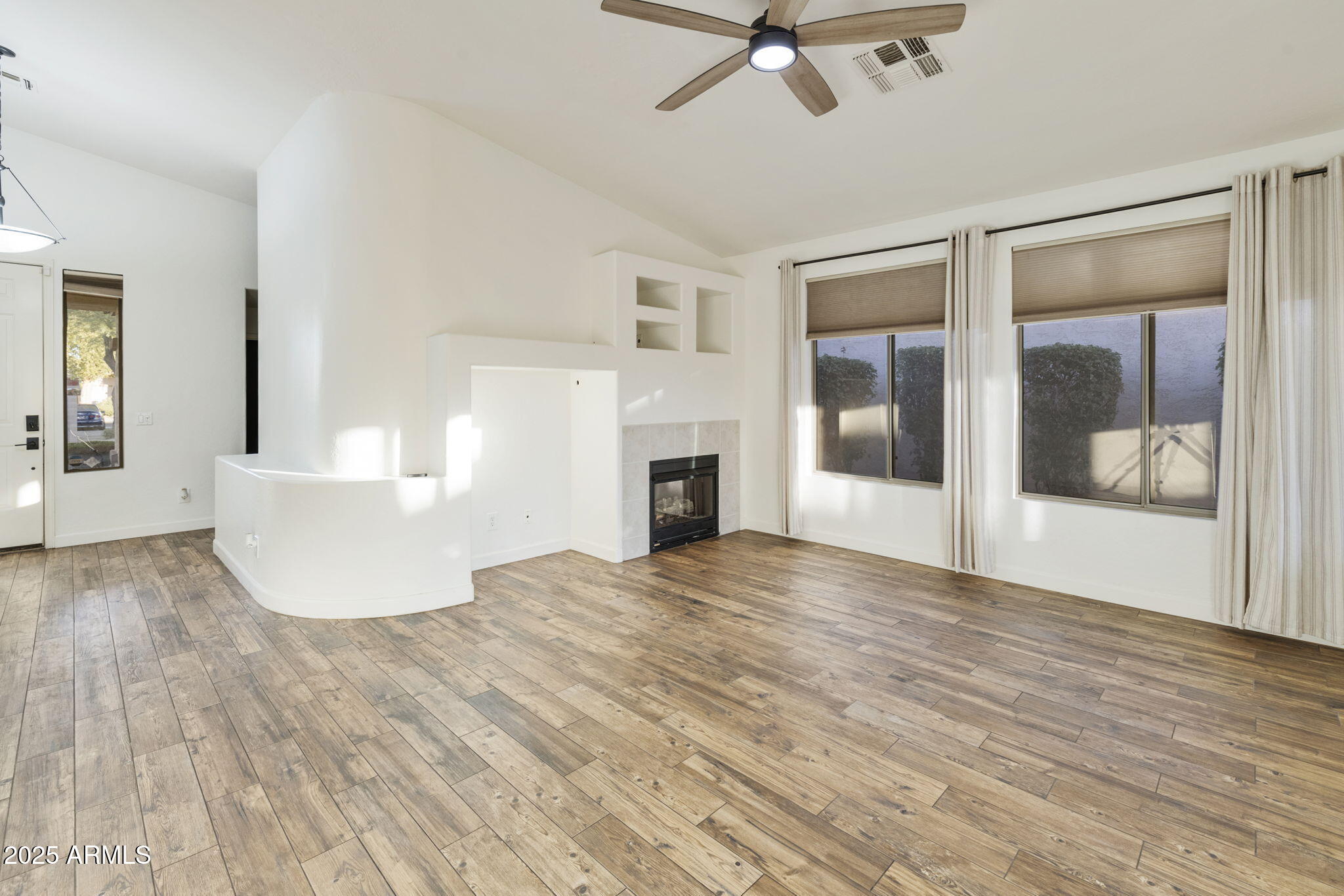 2129 South Compton Mesa, AZ 85209 - Photo 2 of 28 a view of a livingroom with wooden floor and a ceiling fan