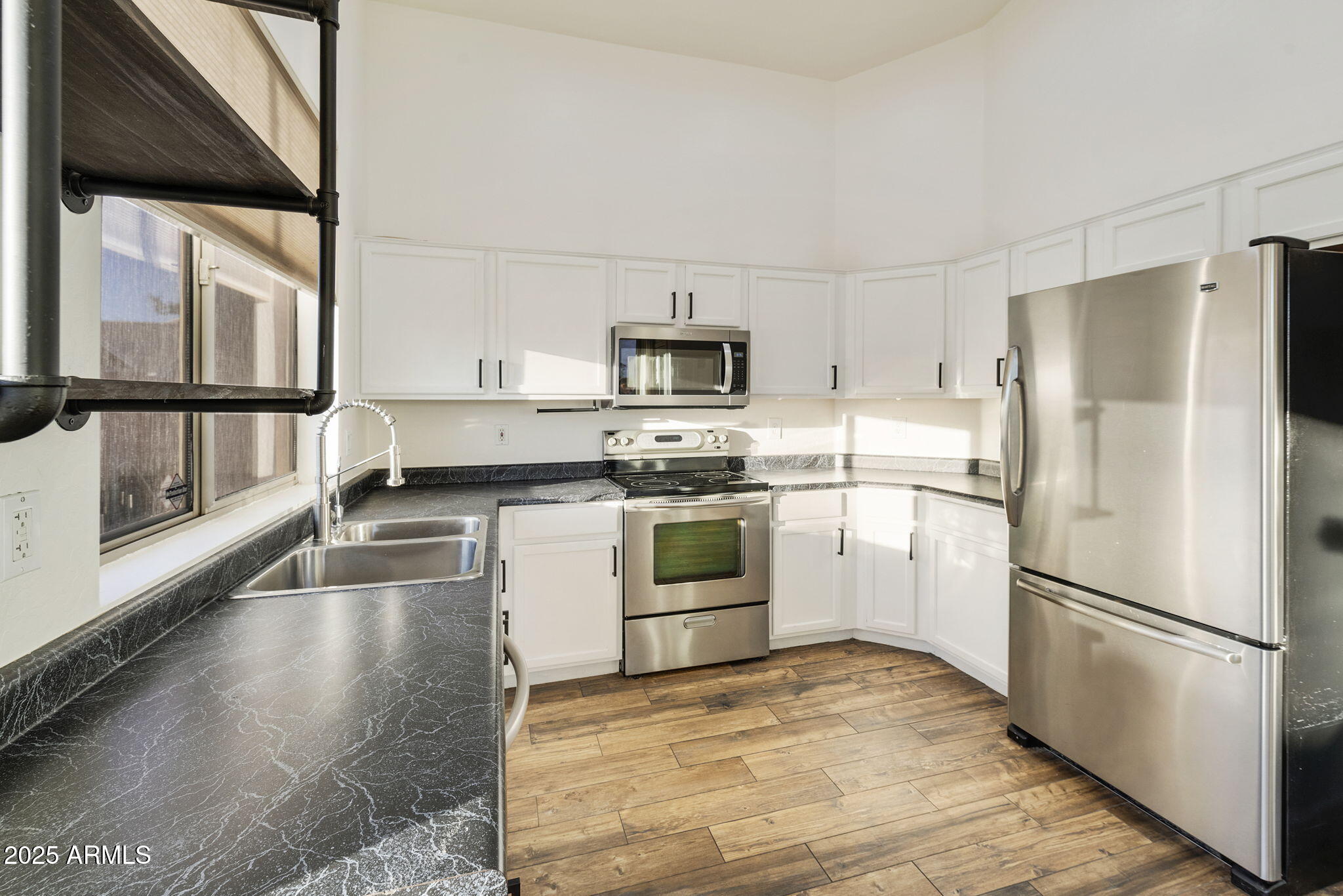 2129 South Compton Mesa, AZ 85209 - Photo 7 of 28 a kitchen with a refrigerator and a stove top oven