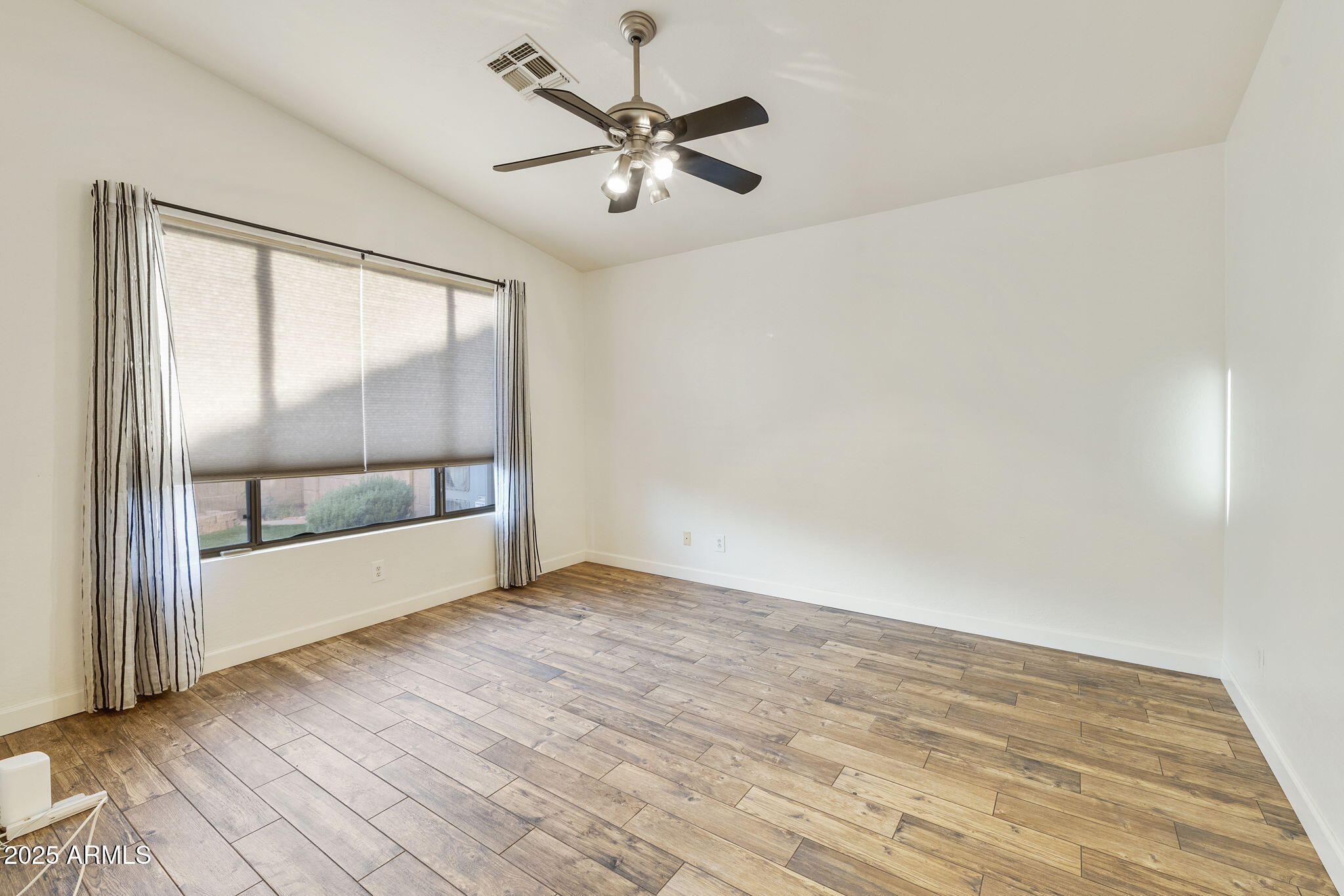 2129 South Compton Mesa, AZ 85209 - Photo 9 of 28 wooden floor in an empty room with a window
