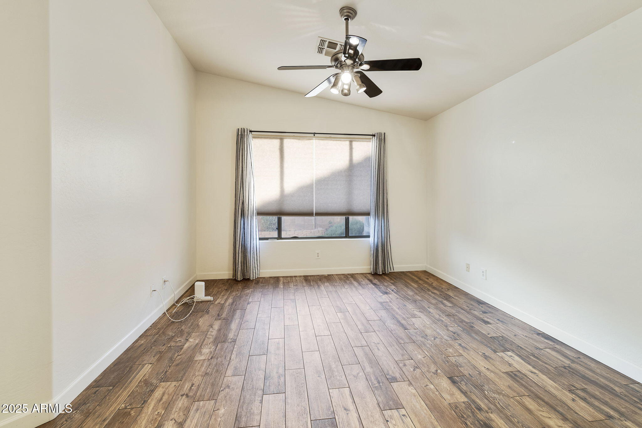 2129 South Compton Mesa, AZ 85209 - Photo 10 of 28 wooden floor in an empty room with a window