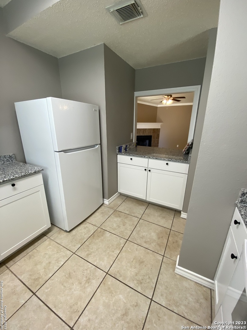 8406 Forest Ridge Drive San Antonio, TX 78239 - Photo 6 of 23 a refrigerator freezer sitting inside of a kitchen