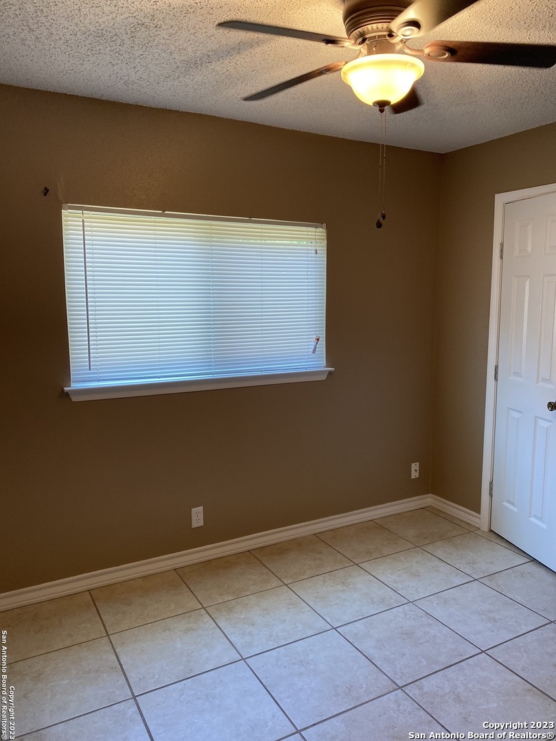 8406 Forest Ridge Drive San Antonio, TX 78239 - Photo 10 of 23 a view of an empty room with a window