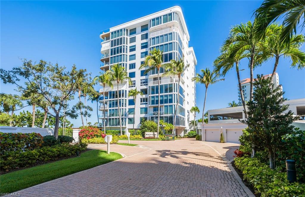 20 Seagate Drive, Unit 803 Naples, FL 34103 - Photo 1 of 44 a view of a building with a yard