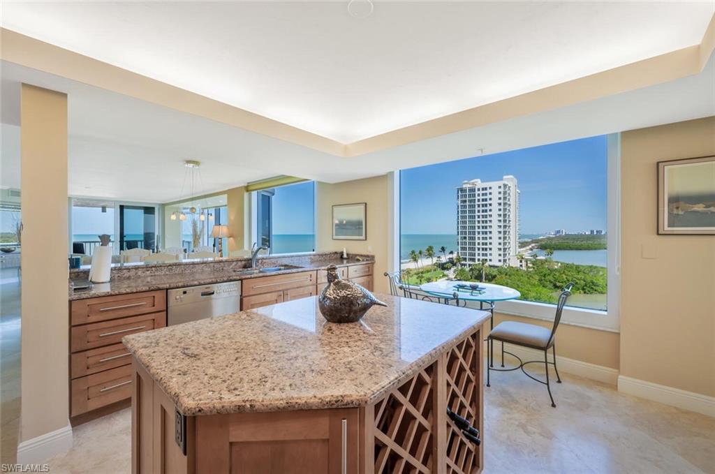 20 Seagate Drive, Unit 803 Naples, FL 34103 - Photo 13 of 44 a dining room with furniture and wooden floor