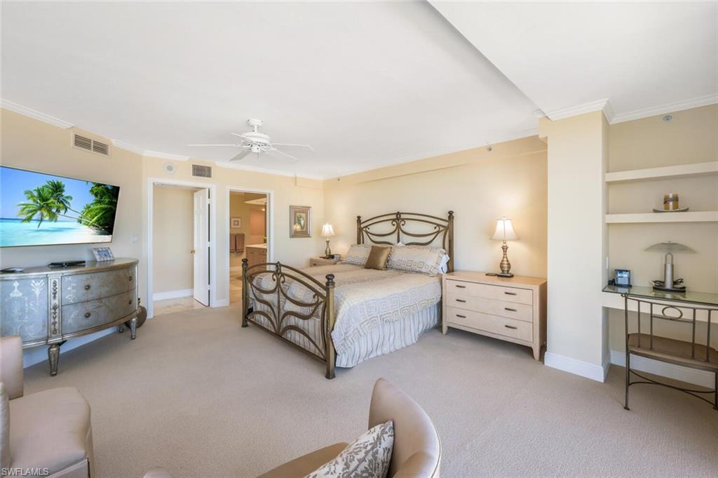 20 Seagate Drive, Unit 803 Naples, FL 34103 - Photo 24 of 44 a bedroom with a bed and a view of bedroom