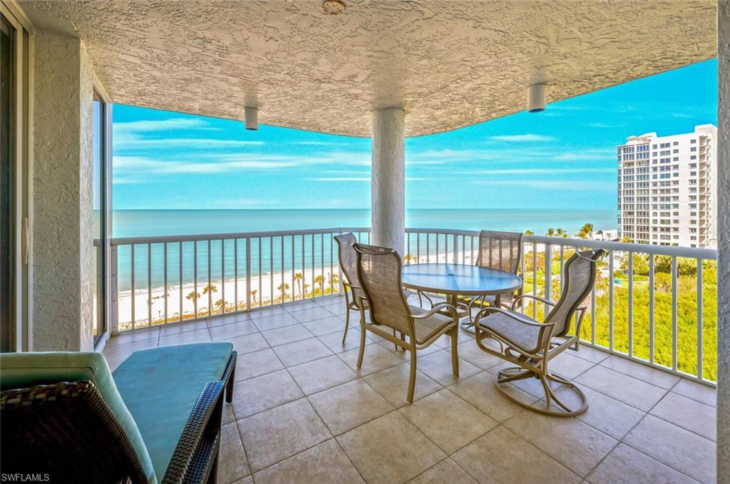 20 Seagate Drive, Unit 803 Naples, FL 34103 - Photo 35 of 44 a view of a chairs and table in the balcony