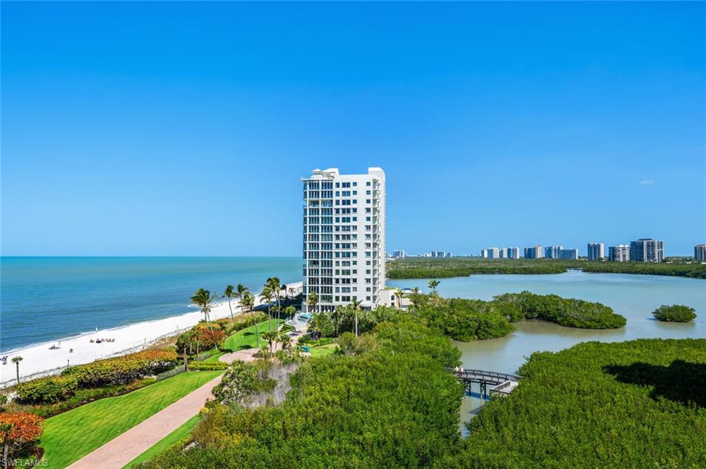 20 Seagate Drive, Unit 803 Naples, FL 34103 - Photo 37 of 44 a view of a lake with a city view