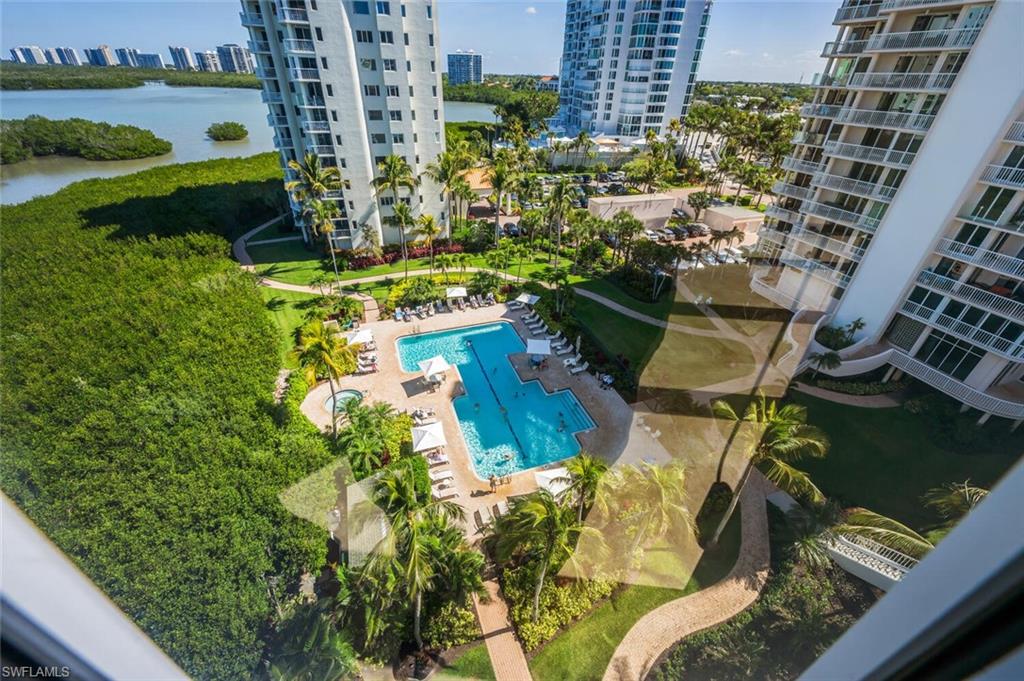 20 Seagate Drive, Unit 803 Naples, FL 34103 - Photo 39 of 44 a view of a lake with a building in the background