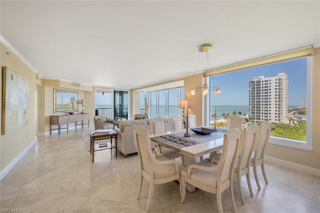 20 Seagate Drive, Unit 803 Naples, FL 34103 - Photo 9 of 44 a dining room with furniture and window