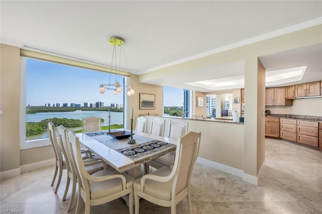20 Seagate Drive, Unit 803 Naples, FL 34103 - Photo 10 of 44 a dining room with furniture and window