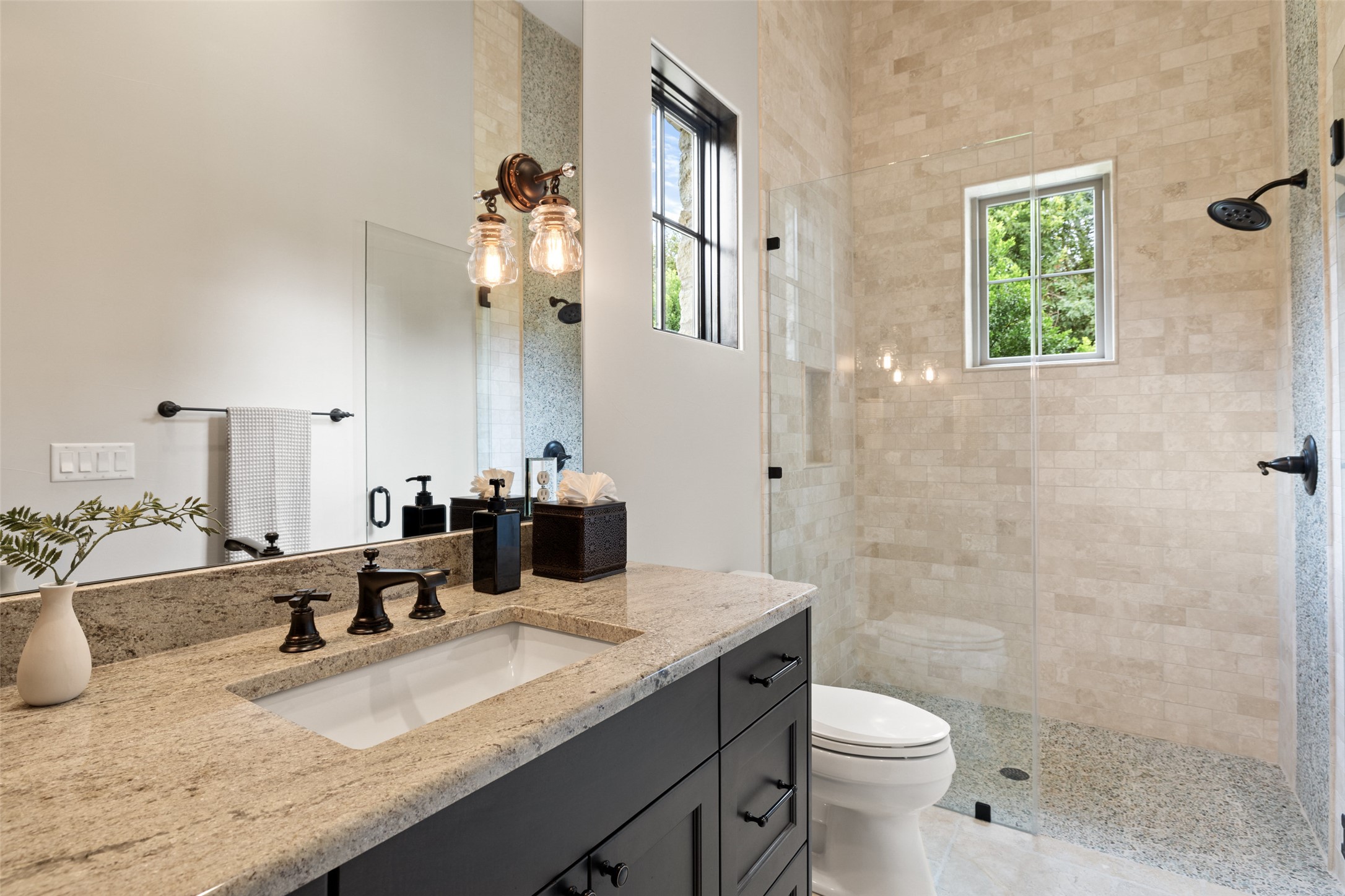 3667 Stoneridge Road Austin, TX 78746 - Photo 31 of 40 The second full bathroom in the guest house is positioned perfectly to double as a pool bath after a day on the lazy river.