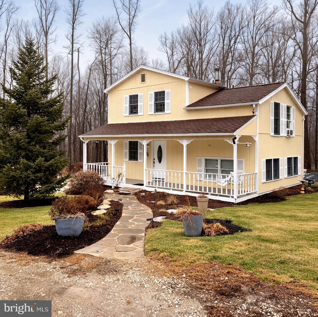 2120 Blue Mt Road Monkton, MD 21111 - Photo 1 of 11 a front view of a house with a garden and swimming pool