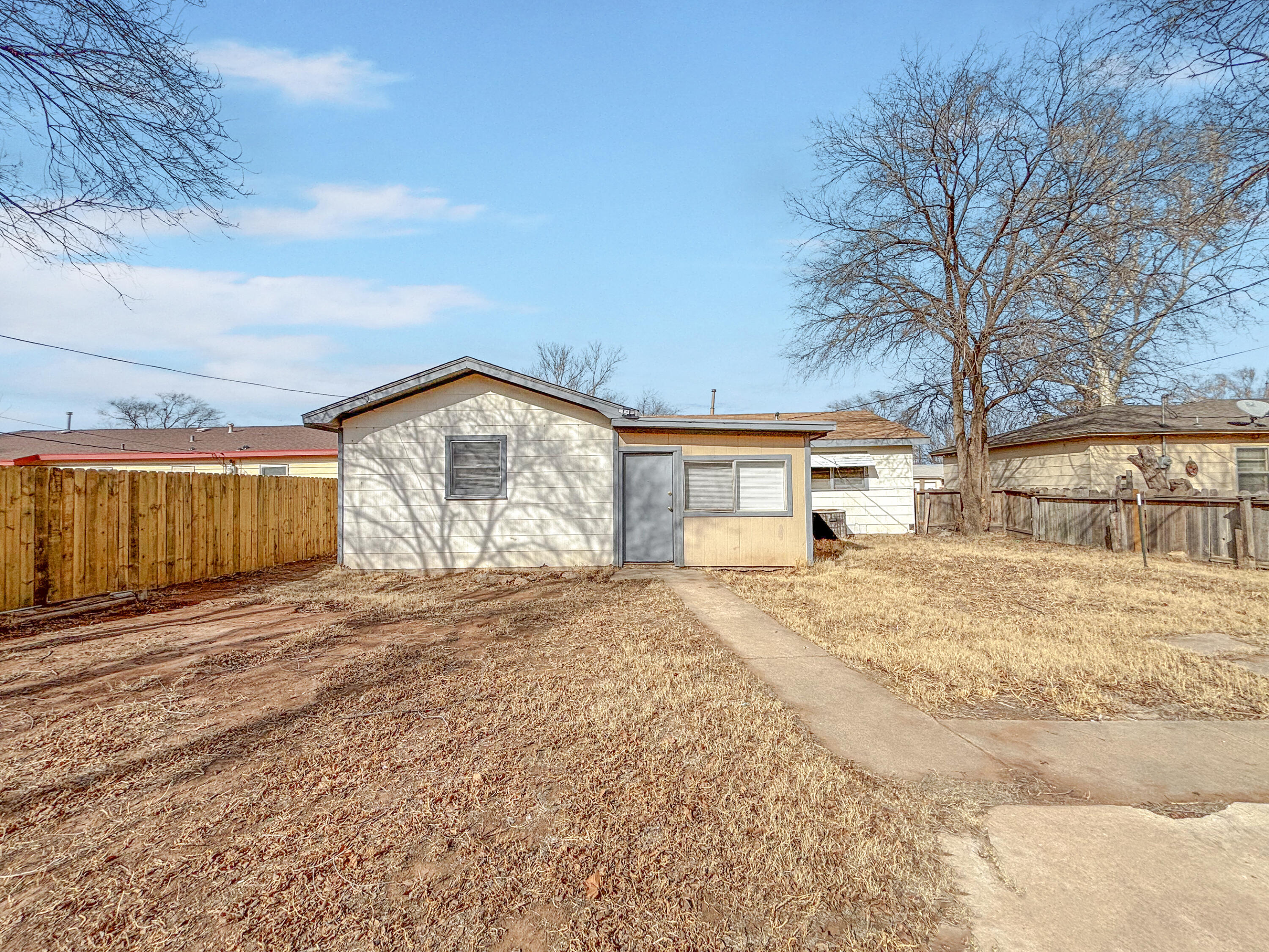 4411 45th Street Lubbock, TX 79414 - Photo 43 of 44 a view of garage with a sink and a yard