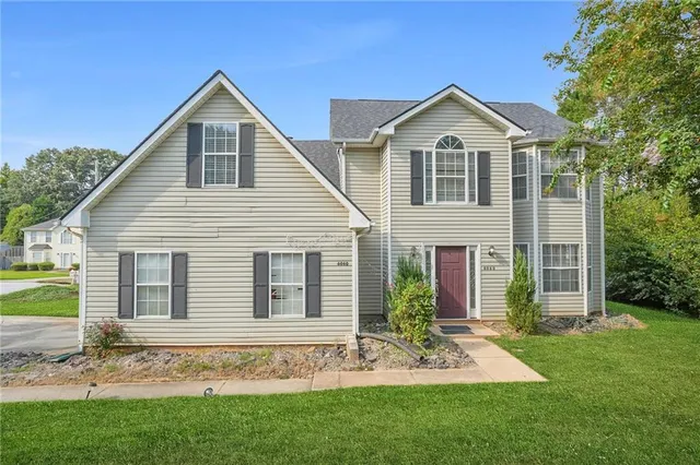 a front view of a house with a yard