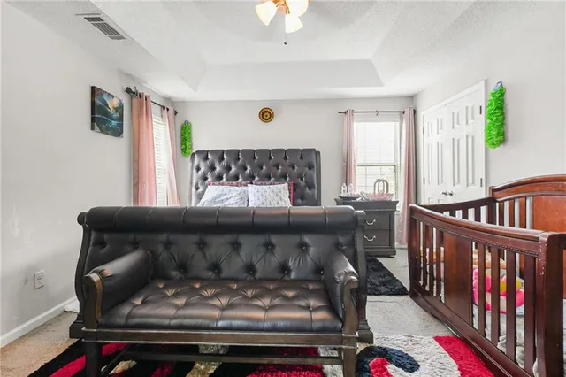 a bedroom with furniture and a window