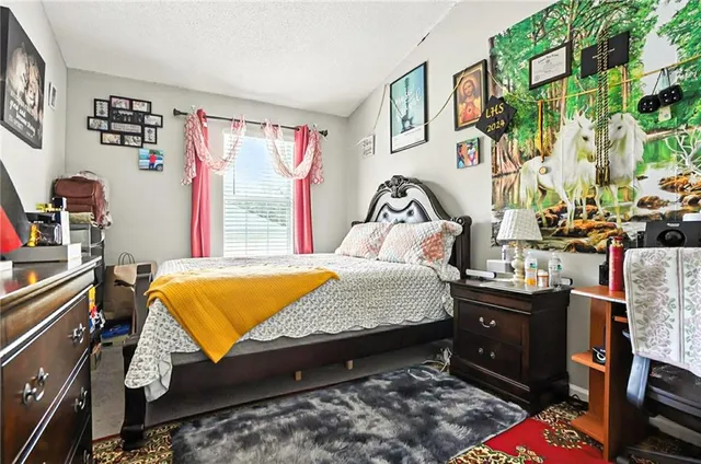 a bed room with a bed and a window