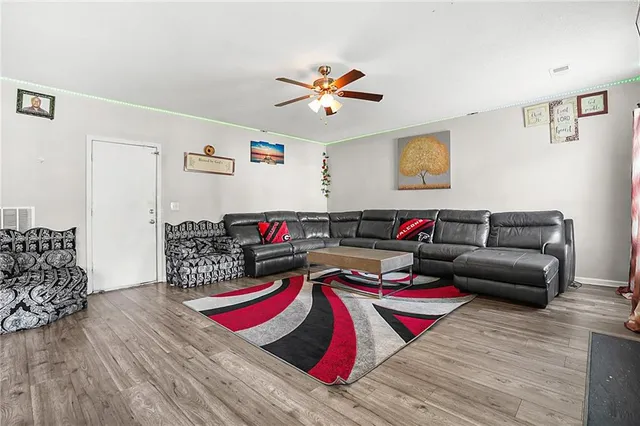 a living room with furniture and rug