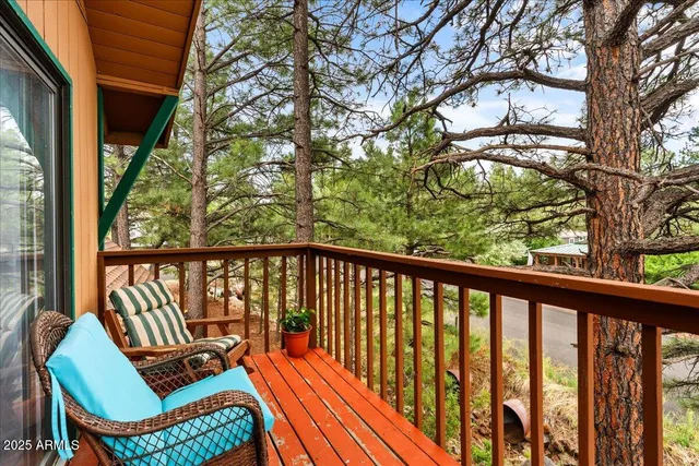 a view of a two chairs in the balcony