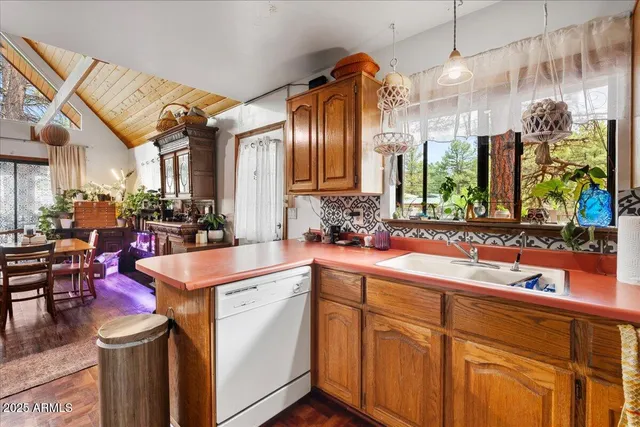 a kitchen that has a lot of cabinets in it
