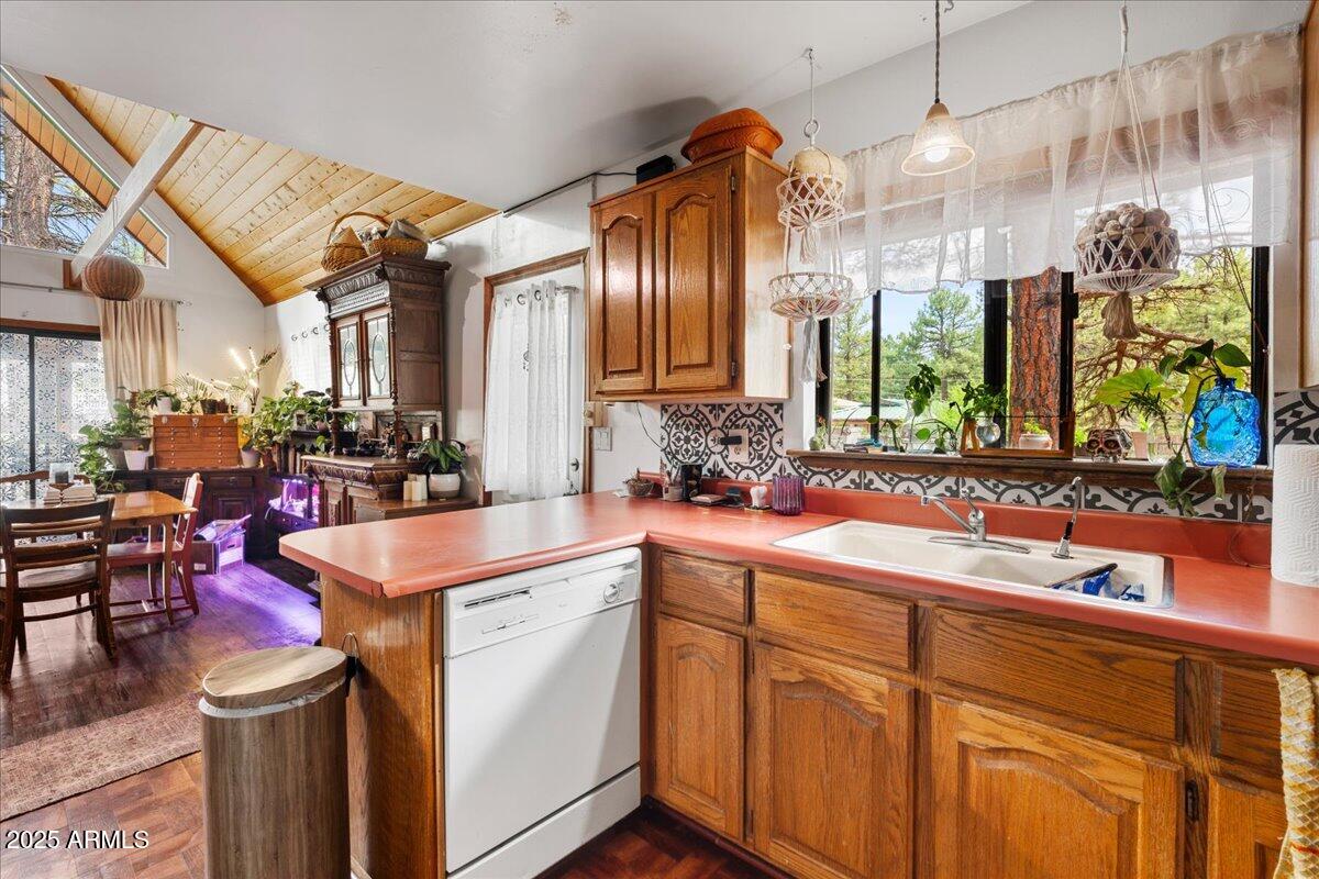 17040 Bowstring Road Munds Park, AZ 86017 - Photo 9 of 18 a kitchen that has a lot of cabinets in it