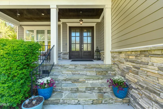 a front view of a house with a porch