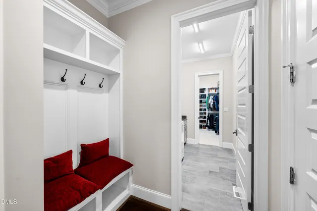 a spacious bedroom with a bed and a large window