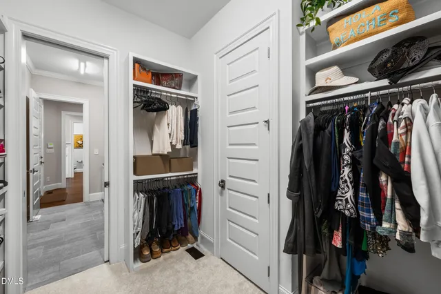 a bedroom with furniture and a flat screen tv